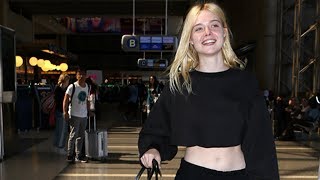 Elle Fanning Shows Off Her Funky Feet While Barefoot At LAX 