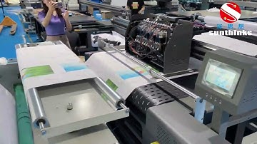single pass package printer with roll to roll device for paper rolls