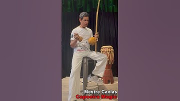 Holding the Berimbau - while playing and singing - Art of Capoeira