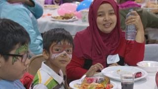 Thanksgiving comes early for group of refugees, immigrants