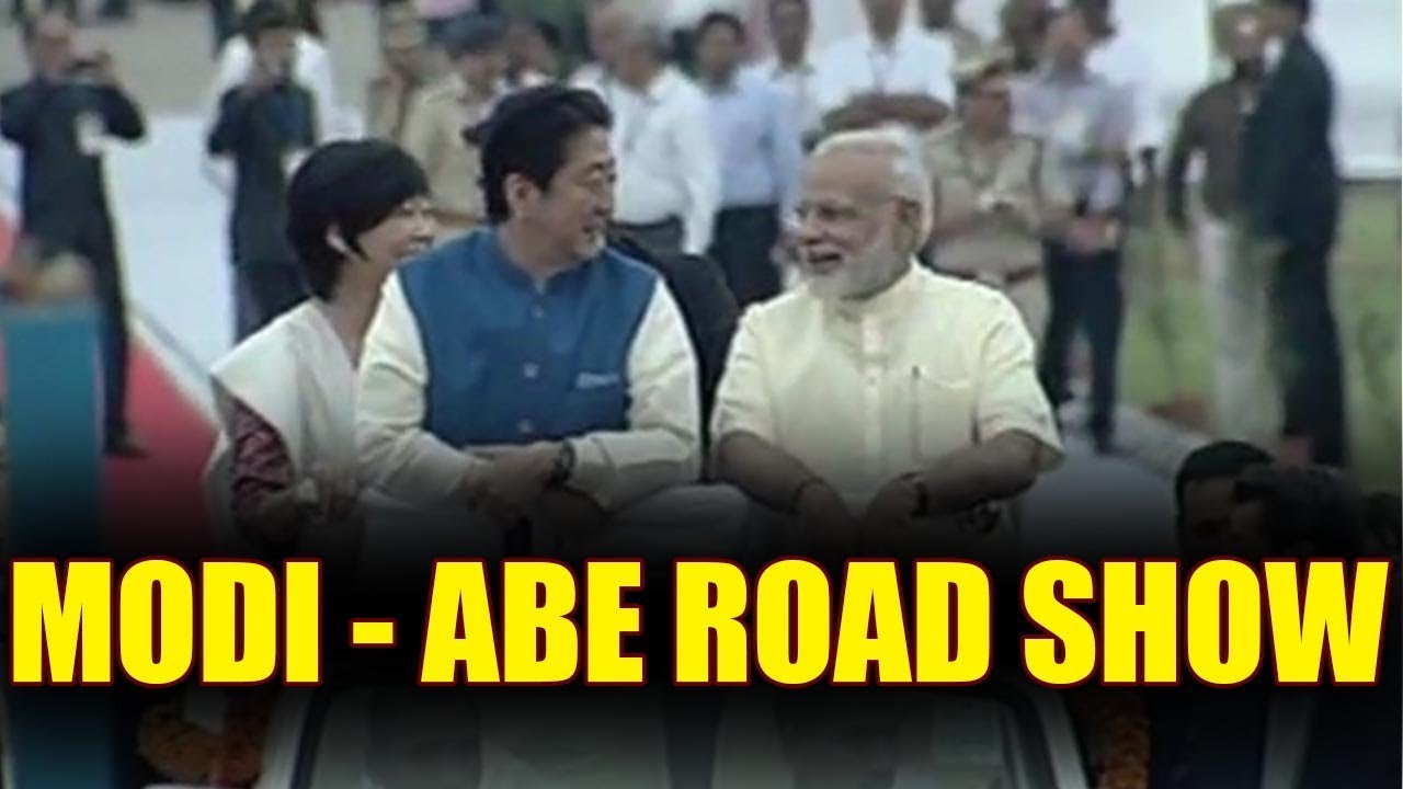 PM Modi welcomes Shinzo Abe in Ahemdabad, take part in Road show, Watch | Oneindia News
