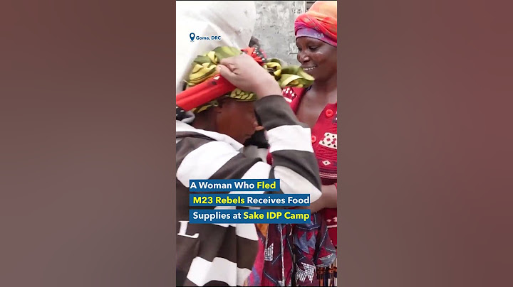 World Refugee Day: A Woman Wh o Fled M23 Rebels Receives Food Supplies at Sake IDP Camp, DRC