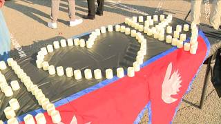 Families in Fairfax County hold a vigil for impacted families in Nepal
