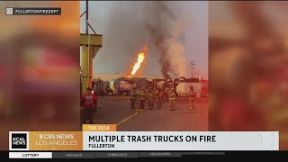 Fullerton Fire Department work to extinguish six trash trucks on fire