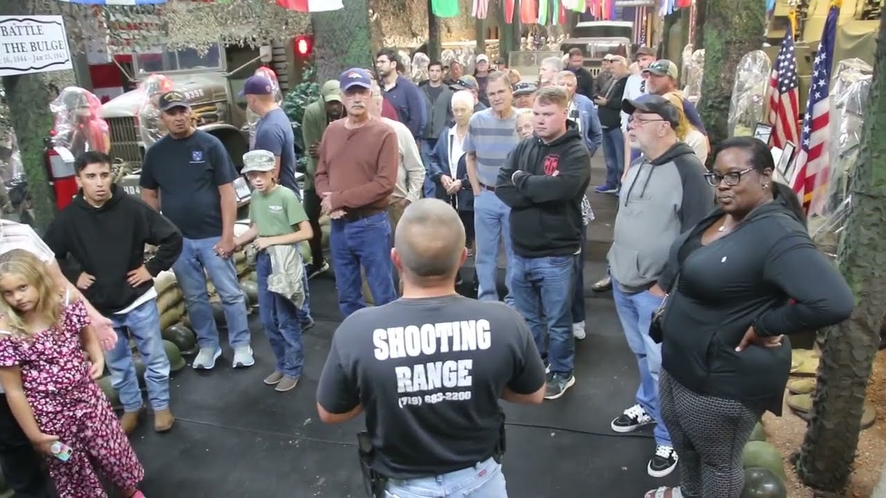Guiding Tour Group Through Battle of the Bulge Display