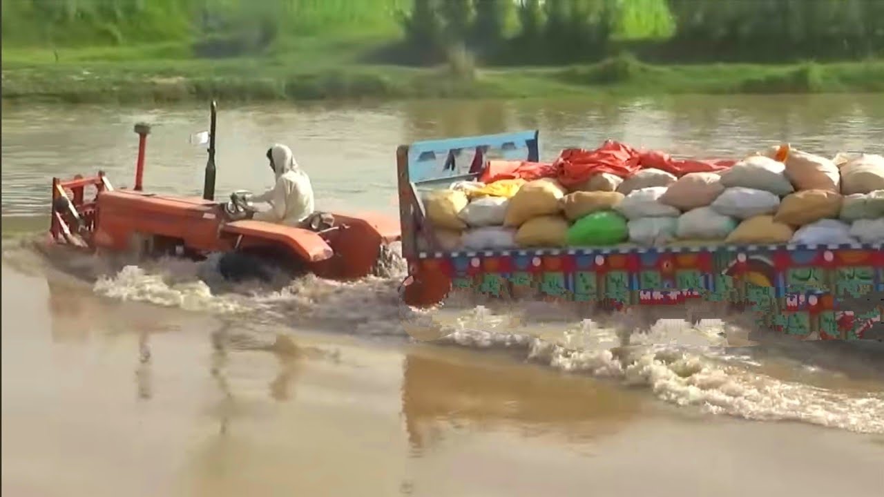 Amazing tractor crossing river | New Holland tractor and loaded Trolley crossing river