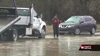 Creek rises, flooding cars near Jim Hill High School