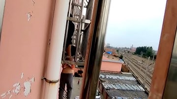 Firefighters rescue boy dangling from fourth floor window