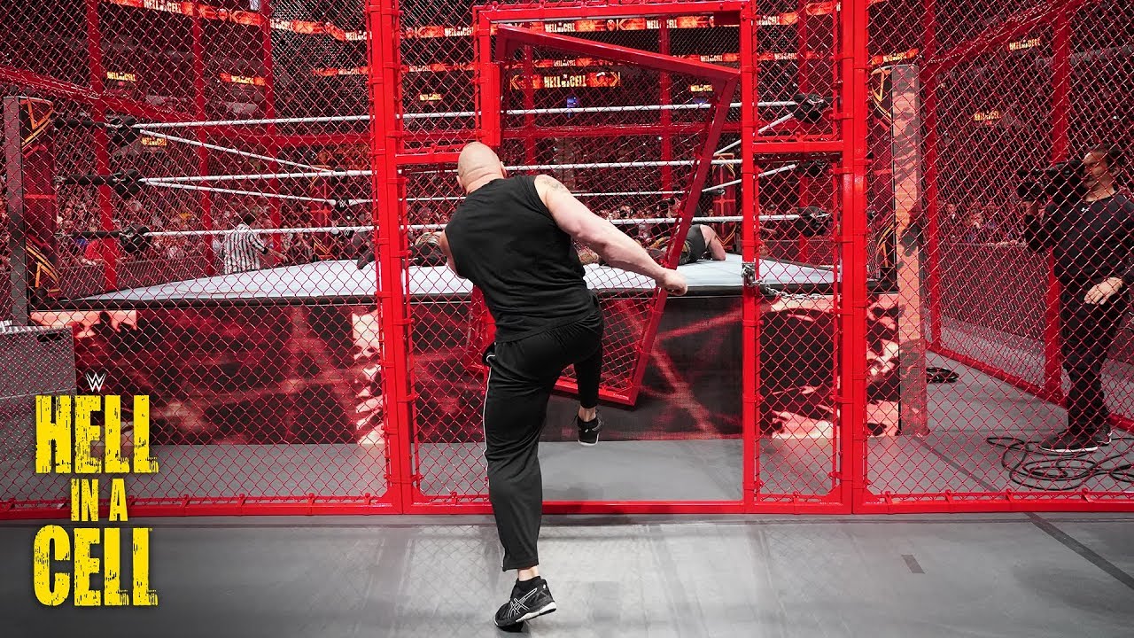 Brock Lesnar kicks the Hell in a Cell door off its hinges WWE Hell in a Cell 2018