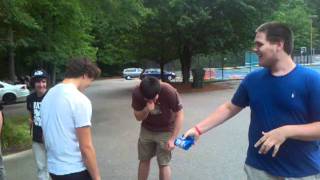 Kid gets punched in the face by a beer koozie