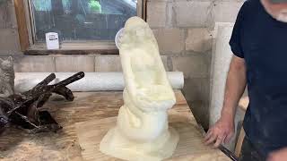 De-molding concrete Mermaid Holding Shell mold. Latex and fiberglass.