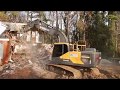 Excavator Tearing Down Old House
