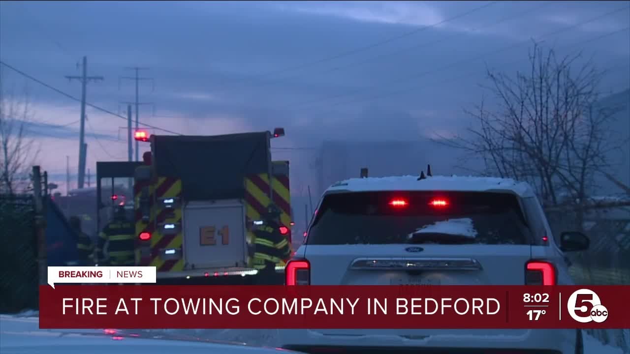Crews battle fire at towing company in Bedford - YouTube