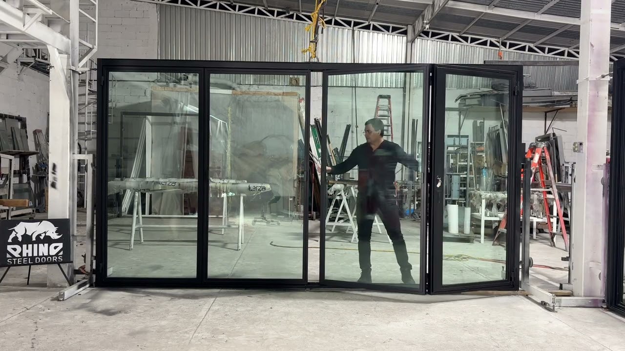 4-Panel Steel Bifold Door with Integrated Swing Door | NYC Rooftop Project by Rhino Steel Doors