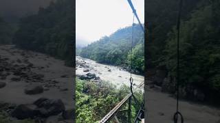 "Magical Stream Flowing Beneath the Hanging Bridge 🌊🌉" #nature #mountainswiev #viral