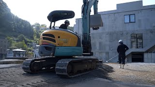 'Transformation from Overgrown Wasteland to Parking Lot: Paving and Clearing Process'