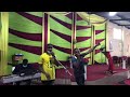 Minister Isreal light in praise session '' When praises go up...Blessings comes down''