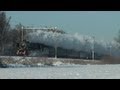 SSN stoomtrein door de sneeuw met enorme stoomwolken.