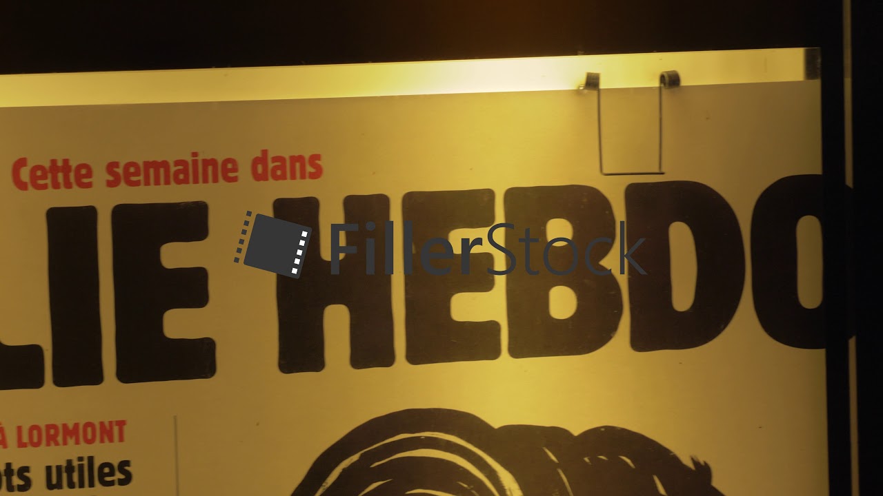 Outdoor poster of French satirical magazine Charlie Hebdo, Paris