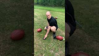How to hold a football for a field goal attempt