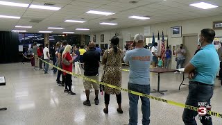 Voters wait in long line to cast early ballot after polls close