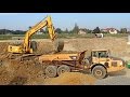 Volvo A35E load by Komatsu PC 240