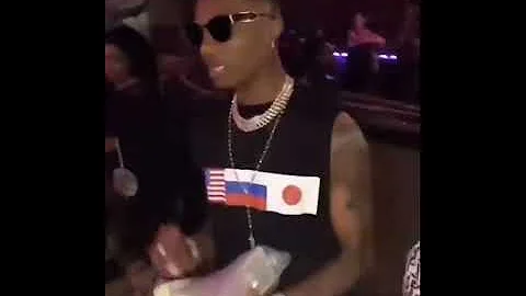 Wizkid throwing money