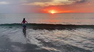 Kids jumping waves