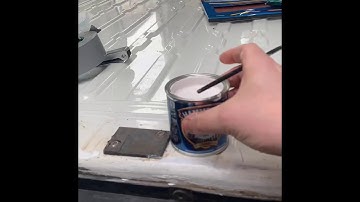 Anti rust and filling screw holes on the van floor ready for battening.