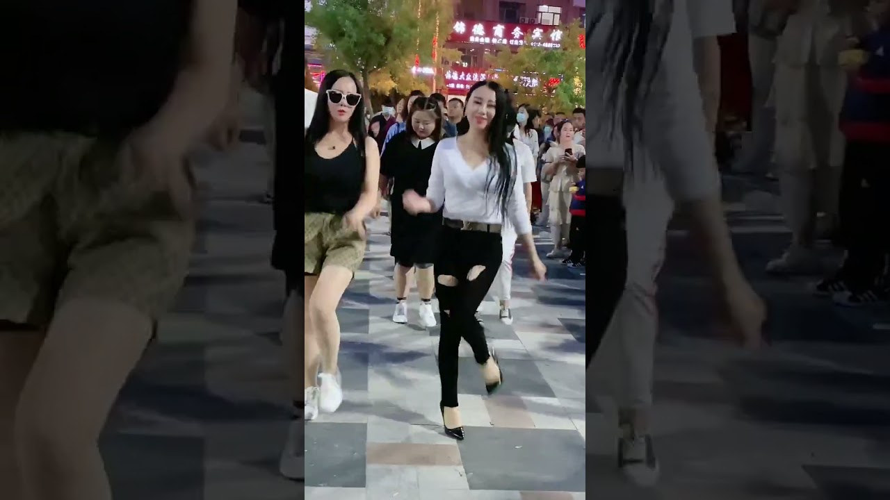 Street photography, beautiful girl's passionate dance  