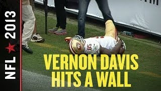 Vernon Davis scores, runs into wall, falls flat, gets slapped in the head by teammate