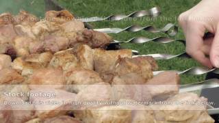 Barbeque skewers with meat cooking on brazier