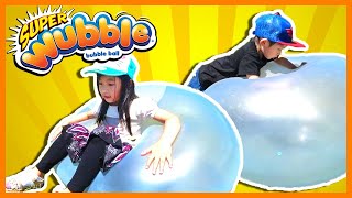 Playing and Fighting with Super Wubble Bubble Ball! The Giant Bouncy Stretchy Ball Ever Made!