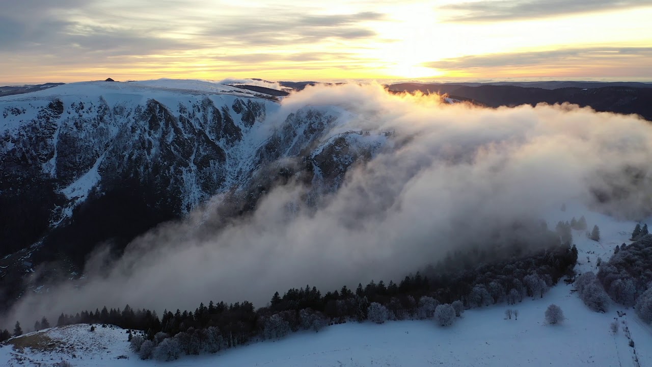 sunrise between clouds and snow
