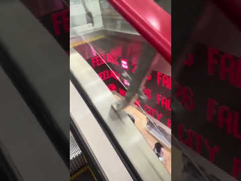 Red handrails on an escalator