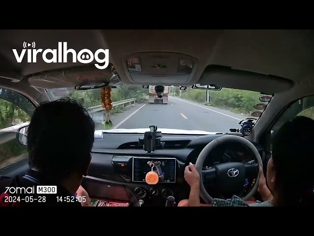 Passing Truck Sends Stray Rock Flying Into Windshield || ViralHog class=