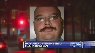 Dozens honor fallen paramedic with green bulbs
