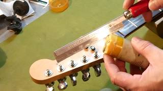 LSR nut installation and fret dressing on a Fender Stratocaster