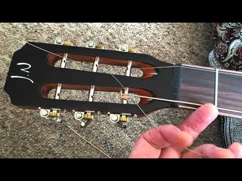 Restringing a slotted headstock guitar - YouTube
