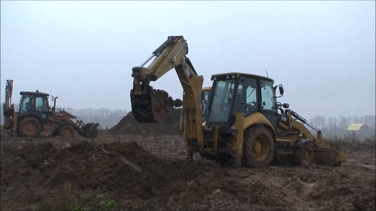 CAT 428F backhoe loader backhoe truck loading test - YouTube
