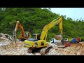 Road Construction Excavator Loading Limestone Trucks