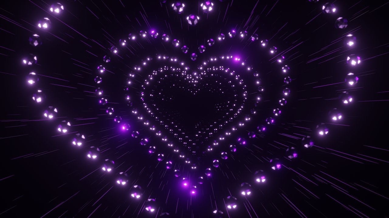 Disco Neon Balls in The Shape of a Heart on a Black Background. 4K 60fps Loop