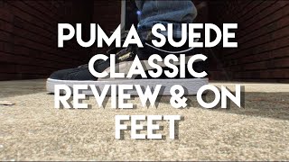 puma suede black white on feet