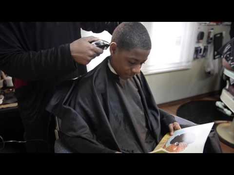 Read to a barber at the Fuller Cut