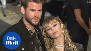 Miley Cyrus and Liam Hemsworth look chic at Saint Laurent show