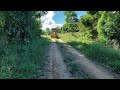 Motoniveladora caterpillar 120k reabrindo estrada na mata
