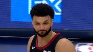 Jamal Murray Tosses A Heat Pad onto the Court during the Game Resimi