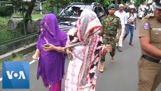 At least two dead and two arrested in raid after Sri Lanka bombings