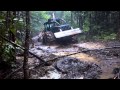 Logging in a little mud with a 525 cat grapple