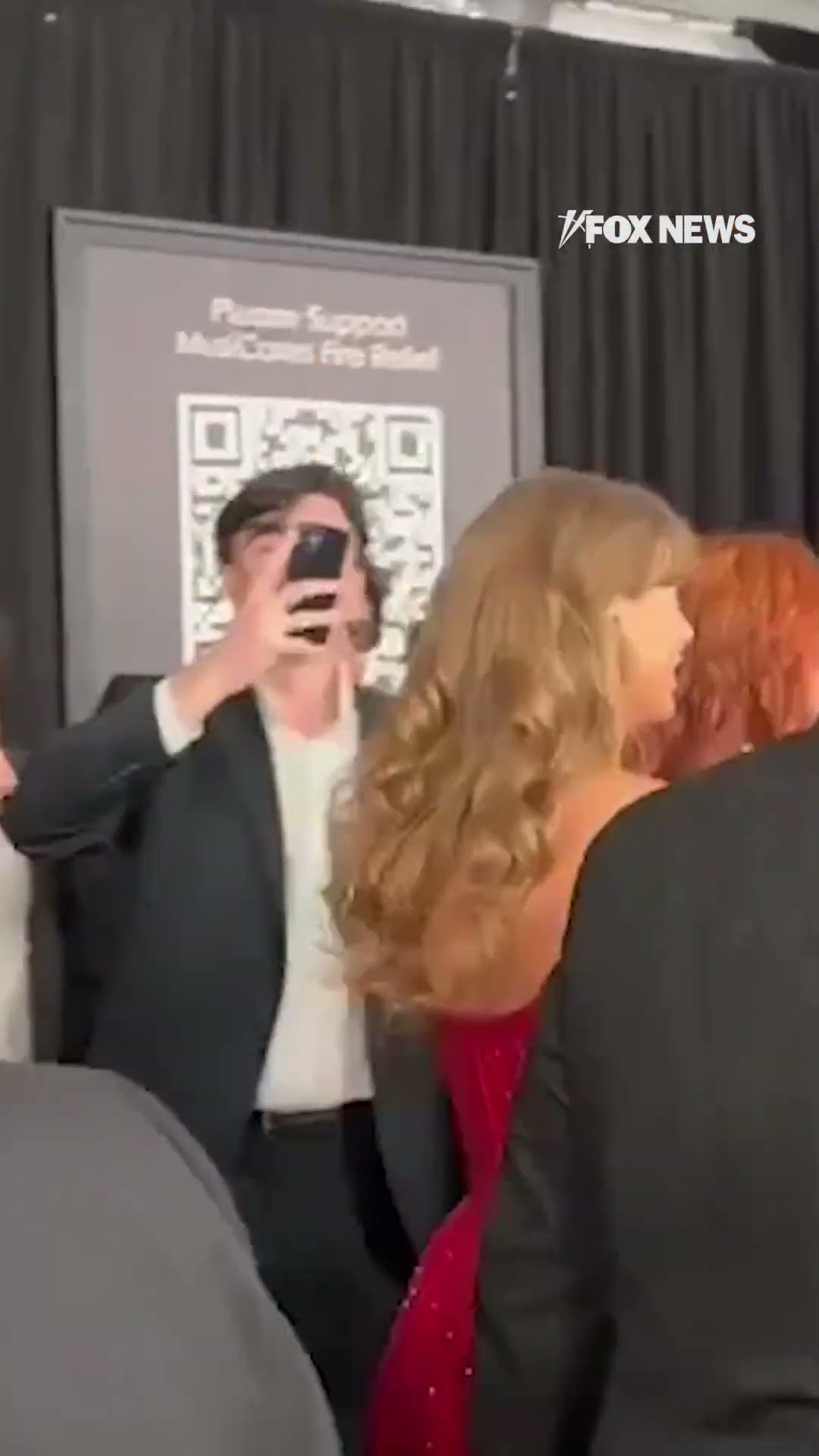 Taylor Swift stuns the 2025 Grammys red carpet with a short, sparkling red dress